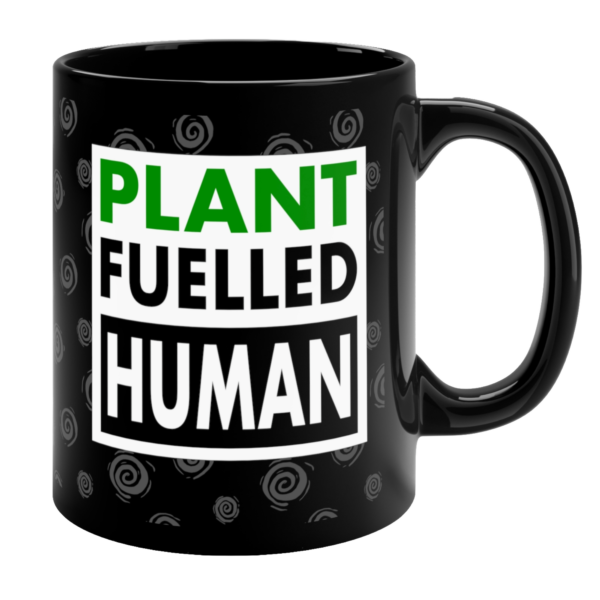 Black Plant Fuelled Human vegan mug with green and white text design